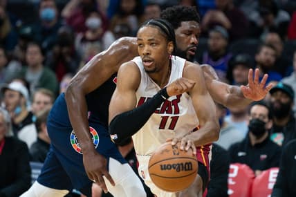 Dec 15, 2021; Philadelphia, Pennsylvania, USA; Miami Heat forward KZ Okpala (11) dribbles past Philadelphia 76ers center Joel Embiid (21) during the second quarter at Wells Fargo Center. Mandatory Credit: Bill Streicher-USA TODAY Sports