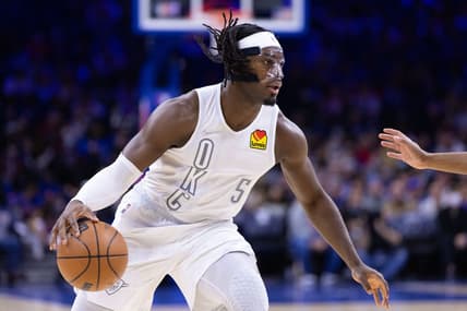Feb 11, 2022; Philadelphia, Pennsylvania, USA; Oklahoma City Thunder forward Luguentz Dort (5) dribbles the ball against the Philadelphia 76ers during the first quarter at Wells Fargo Center. Mandatory Credit: Bill Streicher-USA TODAY Sports