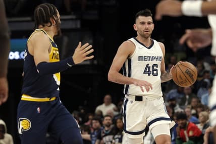 Mar 24, 2022; Memphis, Tennessee, USA; Memphis Grizzlies guard John Konchar (46) dribbles during the second half against the Indiana Pacers at FedExForum. Mandatory Credit: Petre Thomas-USA TODAY Sports