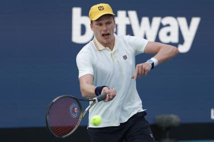 Mar 29, 2022; Miami Gardens, FL, USA; Jenson Brooksby (USA) reacts after winning a point against Daniil Medvedev (not pictured) in a fourth round men's singles match in the Miami Open at Hard Rock Stadium. Mandatory Credit: Geoff Burke-USA TODAY Sports