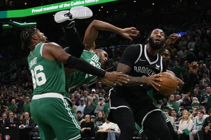 Apr 20, 2022; Boston, Massachusetts, USA; Boston Celtics center Al Horford (42) goes tumbling between guard Marcus Smart (36) and Brooklyn Nets center Andre Drummond (0) during the third quarter of game two of the first round of the 2022 NBA playoffs at TD Garden. Mandatory Credit: Winslow Townson-USA TODAY Sports