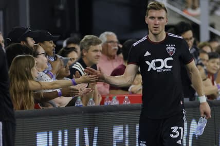 May 21, 2022; Washington, District of Columbia, USA; D.C. United defender Julian Gressel (31) shakes hands with fans while leaving the field after the game against Toronto FC at Audi Field. Mandatory Credit: Geoff Burke-USA TODAY Sports