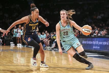 Jun 1, 2022; Brooklyn, New York, USA; New York Liberty guard Sabrina Ionescu (20) drives past Indiana Fever guard Bria Hartley (14) in the third quarter at Barclays Center. Mandatory Credit: Wendell Cruz-USA TODAY Sports