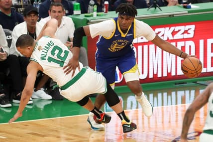Jun 16, 2022; Boston, Massachusetts, USA; Golden State Warriors center Kevon Looney (5) drives to the basket against Boston Celtics forward Grant Williams (12) during the third quarter of game six in the 2022 NBA Finals at the TD Garden. Mandatory Credit: Paul Rutherford-USA TODAY Sports