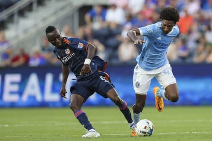 Jun 29, 2022; Cincinnati, Ohio, USA; FC Cincinnati midfielder Obinna Nwobodo (5) battles for the ball against New York City FC forward Talles Magno (43) in the first half at TQL Stadium. Mandatory Credit: Katie Stratman-USA TODAY Sports