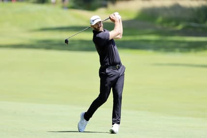 Jul 1, 2022; Portland, Oregon, USA; Dustin Johnson hits from the fairway on the fifth hole during the second round of the LIV Golf tournament at Pumpkin Ridge Golf Club. Mandatory Credit: Soobum Im-USA TODAY Sports