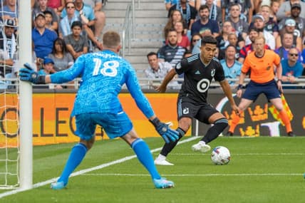 Jul 3, 2022; Saint Paul, Minnesota, USA; Minnesota United midfielder Emanuel Reynoso (10) faces Real Salt Lake goalkeeper Zac MacMath (18) in the first half at Allianz Field. Mandatory Credit: Matt Blewett-USA TODAY Sports