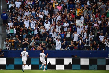 Jul 4, 2022; Carson, California, USA; Los Angeles Galaxy forward Javier Hernandez (14) celebrates his goal scored against CF Montreal with defender Julian Araujo (2) during the first half at Dignity Health Sports Park. Mandatory Credit: Gary A. Vasquez-USA TODAY Sports