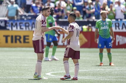 Jul 9, 2022; Seattle, Washington, USA; Portland Timbers forward Jaroslaw Niezgoda (11) shakes hands with midfielder Sebasti  n Blanco (10) after scoring a goal against the Seattle Sounders FC during the first half at Lumen Field. Mandatory Credit: Joe Nicholson-USA TODAY Sports