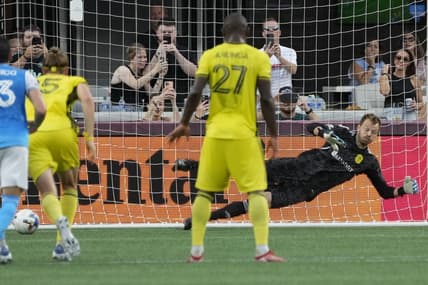 Jul 9, 2022; Charlotte, North Carolina, USA; Nashville SC goalkeeper Joe Willis (1) misses the penalty kick by Charlotte FC defender Christian Fuchs (22) during the first half at Bank of America Stadium. Mandatory Credit: Jim Dedmon-USA TODAY Sports
