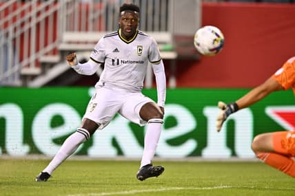 Jul 9, 2022; Chicago, Illinois, USA;  Columbus Crew SC midfielder Derrick Etienne (22) scores a goal in the second half against the Chicago Fire FC at Soldier Field. Mandatory Credit: Jamie Sabau-USA TODAY Sports