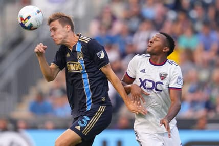 Jul 8, 2022; Chester, Pennsylvania, USA; Philadelphia Union defender Jack Elliott (3) plays the ball off his head against D.C. United forward Michael Estrada (7) at Subaru Park. Mandatory Credit: Mitchell Leff-USA TODAY Sports