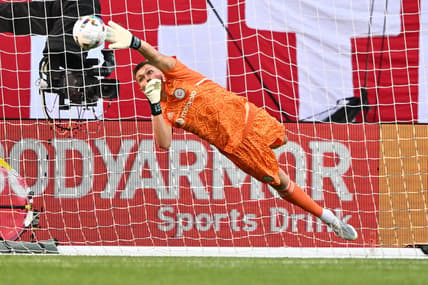 Jul 13, 2022; Chicago, Illinois, USA;  Chicago Fire FC goalkeeper Gaga Slonina (1) redirects a Toronto FC shot away from the net with his fingertips in the first half at Soldier Field. Mandatory Credit: Jamie Sabau-USA TODAY Sports