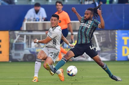Jul 13, 2022; Carson, California, USA; Los Angeles Galaxy forward Raheem Edwards (44) plays for the ball against San Jose Earthquakes forward Cristian Espinoza (10) during the first half at Dignity Health Sports Park. Mandatory Credit: Gary A. Vasquez-USA TODAY Sports