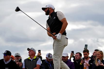 Jul 14, 2022; St. Andrews, SCT; Dustin Johnson takes a shot on the 14th hole during the first round of the 150th Open Championship golf tournament at St. Andrews Old Course. Mandatory Credit: Rob Schumacher-USA TODAY Sports