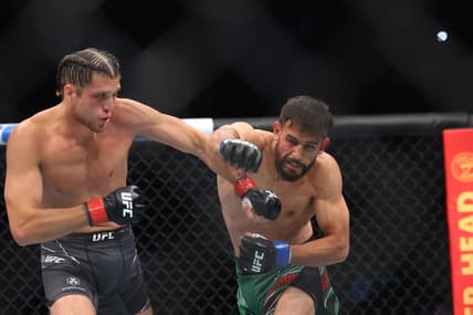 Jul 16, 2022; Elmont, New York, USA; Brian Ortega (red gloves) fights Yair Rodriguez (blue gloves) during UFC Fight Night at UBS Arena. Mandatory Credit: Ed Mulholland-USA TODAY Sports