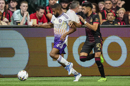 Jul 17, 2022; Atlanta, Georgia, USA; Orlando City defender Ruan (2) tries for the ball defended by Atlanta United midfielder Marcelino Moreno (10) during the first half at Mercedes-Benz Stadium. Mandatory Credit: Dale Zanine-USA TODAY Sports