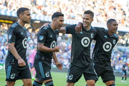 Jul 20, 2022; Minneapolis, MN, USA; Minnesota United midfielder Emanuel Reynoso (10) celebrates his penalty kick goal against Everton with midfielder Franco Fragapane (7), forward Luis Amarilla (9) and midfielder Joseph Rosales (8) in the first half at Allianz Field. Mandatory Credit: Matt Blewett-USA TODAY Sports