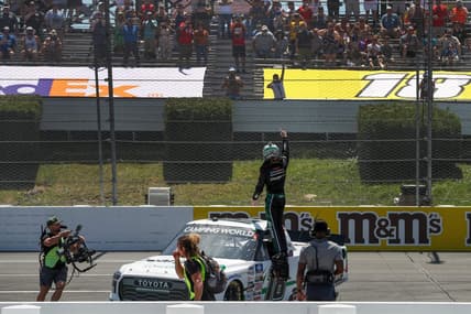 Jul 23, 2022; Long Pond, Pennsylvania, USA; NASCAR Camping World Truck Series driver Chandler Smith celebrates after winning the CRC Brakleen 150 at Pocono Raceway. Mandatory Credit: Matthew OHaren-USA TODAY Sports