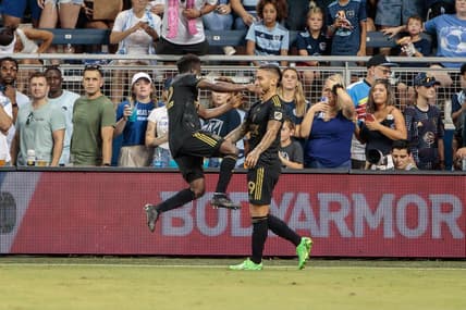 Jul 23, 2022; Kansas City, Kansas, USA; Los Angeles FC forward Cristian Arango (9) celebrates with defender Franco Escobar (2) after a goal against the Sporting Kansas City during the second half at Children's Mercy Park. Mandatory Credit: William Purnell-USA TODAY Sports