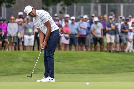Jul 28, 2022; Detroit, Michigan, USA; Tony Finau putts on the ninth green during the first round of the Rocket Mortgage Classic golf tournament. Mandatory Credit: Raj Mehta-USA TODAY Sports