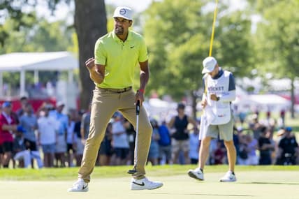 Jul 31, 2022; Detroit, Michigan, USA; Tony Finau pumps his fist after making birdie on the par 4 twelfth hole during the final round of the Rocket Mortgage Classic golf tournament. Mandatory Credit: Raj Mehta-USA TODAY Sports