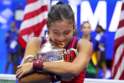 Sep 11, 2021; Flushing, NY, USA; Emma Raducanu of Great Britain celebrates with the championship trophy after her match against Leylah Fernandez of Canada (not pictured) in the women's singles final on day thirteen of the 2021 U.S. Open tennis tournament at USTA Billie Jean King National Tennis Center. Mandatory Credit: Robert Deutsch-USA TODAY Sports