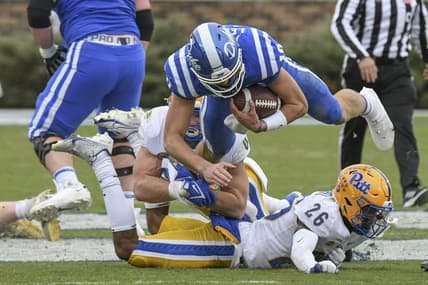 Nov 6, 2021; Durham, North Carolina, USA;  Duke Blue Devils quarterback Riley Leonard (10) is tackled on a keeper during the third quarter against the Pittsburgh Panthers at Wallace Wade Stadium. Mandatory Credit: William Howard-USA TODAY Sports