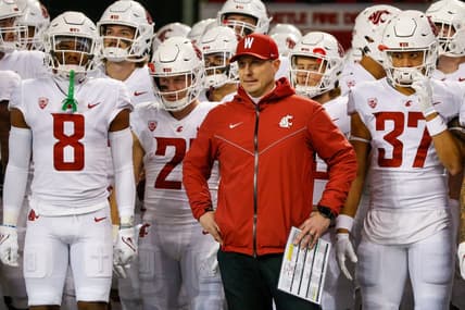 Nov 26, 2021; Seattle, Washington, USA; Washington State Cougars head coach Jake Dickert stands outside the locker room with wide receiver Calvin Jackson Jr. (8), running back Max Borghi (21) and linebacker Justus Rogers (37) before kickoff against the Washington Huskies at Alaska Airlines Field at Husky Stadium. Mandatory Credit: Joe Nicholson-USA TODAY Sports