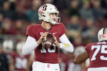 Nov 27, 2021; Stanford, California, USA; Stanford Cardinal quarterback Tanner McKee (18) drops back to pass during the first quarter against the Notre Dame Fighting Irish at Stanford Stadium. Mandatory Credit: Darren Yamashita-USA TODAY Sports
