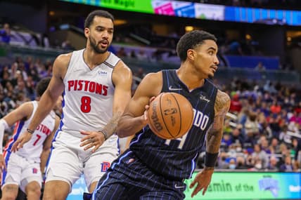 Jan 28, 2022; Orlando, Florida, USA; Orlando Magic guard Gary Harris (14) moves the ball past Detroit Pistons forward Trey Lyles (8) during the second half at Amway Center. Mandatory Credit: Mike Watters-USA TODAY Sports