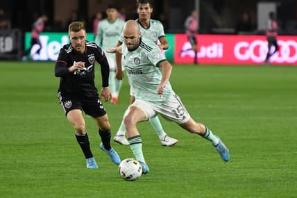 Apr 2, 2022; Washington, District of Columbia, USA;  Atlanta United defender Andrew Gutman (15) takes a shot by D.C. United defender Julian Gressel (31) in the second half at Audi Field. Mandatory Credit: Mitchell Layton-USA TODAY Sports