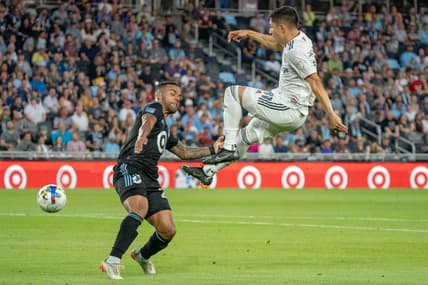 Jul 3, 2022; Saint Paul, Minnesota, USA; Real Salt Lake forward Jefferson Savarino (11) shoots, defended by Minnesota United defender D.J. Taylor (27) in the second half at Allianz Field. Mandatory Credit: Matt Blewett-USA TODAY Sports