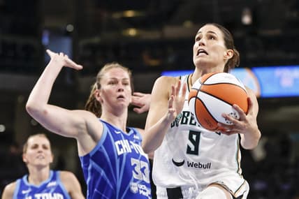 Jul 29, 2022; Chicago, Illinois, USA; New York Liberty guard Rebecca Allen (9) goes to the basket against Chicago Sky forward Emma Meesseman (33) during the second half of the WNBA game at Wintrust Arena. Mandatory Credit: Kamil Krzaczynski-USA TODAY Sports