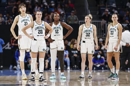 Jul 29, 2022; Chicago, Illinois, USA; New York Liberty center Han Xu (21), guard Sabrina Ionescu (20), forward Michaela Onyenwere (12), guard Sami Whitcomb (32) and guard Marine Johannes (23) stand on the court during the second half of the WNBA game against the Chicago Sky at Wintrust Arena. Mandatory Credit: Kamil Krzaczynski-USA TODAY Sports