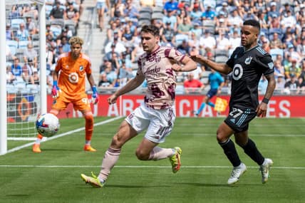 Jul 30, 2022; Saint Paul, Minnesota, USA; Portland Timbers forward Jaroslaw Niezgoda (11) is challenged by Minnesota United defender D.J. Taylor (27) in the second half at Allianz Field. Mandatory Credit: Matt Blewett-USA TODAY Sports