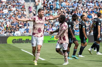 Jul 30, 2022; Saint Paul, Minnesota, USA; Portland Timbers forward Jaroslaw Niezgoda (11) is congratulated by forward Yimmi Char   (23) after scoring on Minnesota United in the second half at Allianz Field. Mandatory Credit: Matt Blewett-USA TODAY Sports