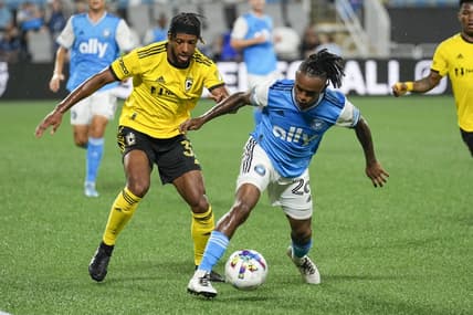 Jul 30, 2022; Charlotte, North Carolina, USA; Columbus Crew defender Steven Moreira (31) tries to steal the ball from Charlotte FC forward Yordi Reyna (26) during the first half at Bank of America Stadium. Mandatory Credit: Jim Dedmon-USA TODAY Sports