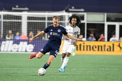 Jul 30, 2022; Foxborough, MA, USA; New England Revolution defender Henry Kessler (4) controls the ball in front of Toronto FC forward Jayden Nelson (11) during the first half at Gillette Stadium. Mandatory Credit: Eric Canha-USA TODAY Sports