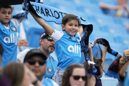 Aug 3, 2022; Charlotte, North Carolina, USA; A young Charlotte FC fan shows his colors during the first half against the D.C. United at Bank of America Stadium. Mandatory Credit: Jim Dedmon-USA TODAY Sports
