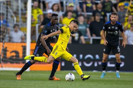 Aug 3, 2022; Columbus, Ohio, USA; Columbus Crew midfielder Lucas Zelaray  n (10) kicks the ball while CF Montreal midfielder Victor Wanyama (2) defends in the first half at Lower.com Field. Mandatory Credit: Trevor Ruszkowski-USA TODAY Sports
