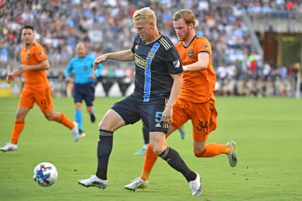 Jul 30, 2022; Chester, Pennsylvania, USA; Philadelphia Union defender Jakob Glesnes (5) shields the ball from Houston Dynamo forward   orleifur   lfarsson (34) during the first half at Subaru Park. Mandatory Credit: Eric Hartline-USA TODAY Sports