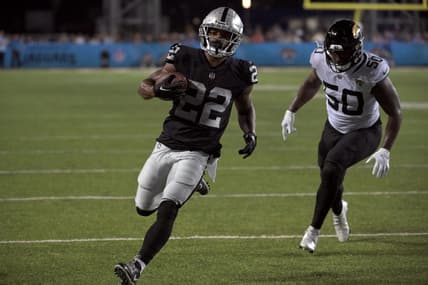 Aug 4, 2022; Canton, Ohio, USA; Las Vegas Raiders running back Ameer Abdullah (22) runs for a touchdown against Jacksonville Jaguars linebacker Shaquille Quarterman (50) in the second quarter in the Hall of Fame game at Tom Benson Hall of Fame Stadium. Mandatory Credit: Ken Blaze-USA TODAY Sports