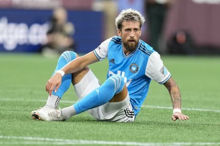 Aug 6, 2022; Charlotte, North Carolina, USA; Charlotte FC defender Guzman Corujo (4) goes down with an injury against the Chicago Fire during the first half at Bank of America Stadium. Mandatory Credit: Jim Dedmon-USA TODAY Sports
