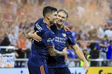 Aug 6, 2022; Cincinnati, Ohio, USA; FC Cincinnati forward Brandon Vazquez (19) celebrates with teammate defender Nick Hagglund (4) after scoring a goal against the Philadelphia Union in the second half at TQL Stadium. Mandatory Credit: Aaron Doster-USA TODAY Sports