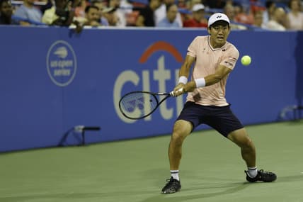 Aug 6, 2022; Washington, DC, USA; Yoshihito Nishioka (JPN) hits a backhand against Andrey Rublev (not pictured) in a men's single's semifinal on day six of the Citi Open at Rock Creek Park Tennis Center. Mandatory Credit: Geoff Burke-USA TODAY Sports