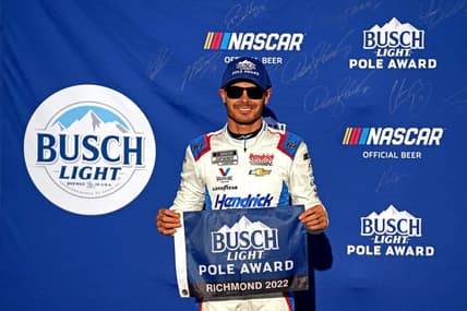 Aug 13, 2022; Richmond, Virginia, USA; NASCAR Cup Series driver Kyle Larson (5) celebrates winning the pole during practice and qualifying for the Federated Auto Parts 400 at Richmond International Raceway. Mandatory Credit: Peter Casey-USA TODAY Sports