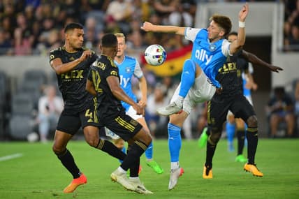 Aug 13, 2022; Los Angeles, California, USA; Charlotte FC midfielder Quinn McNeill (35) plays for the ball against Los Angeles FC during the first half at Banc of California Stadium. Mandatory Credit: Gary A. Vasquez-USA TODAY Sports