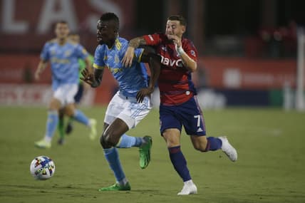 Aug 17, 2022; Frisco, Texas, USA; Philadelphia Union forward Cory Burke (19) controls the ball against FC Dallas forward Paul Arriola (7) in the first half at Toyota Stadium. Mandatory Credit: Tim Heitman-USA TODAY Sports