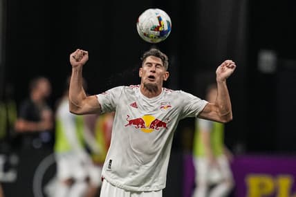 Aug 17, 2022; Atlanta, Georgia, USA; New York Red Bulls defender Sean Nealis (15) heads the ball against Atlanta United during the second half at Mercedes-Benz Stadium. Mandatory Credit: Dale Zanine-USA TODAY Sports